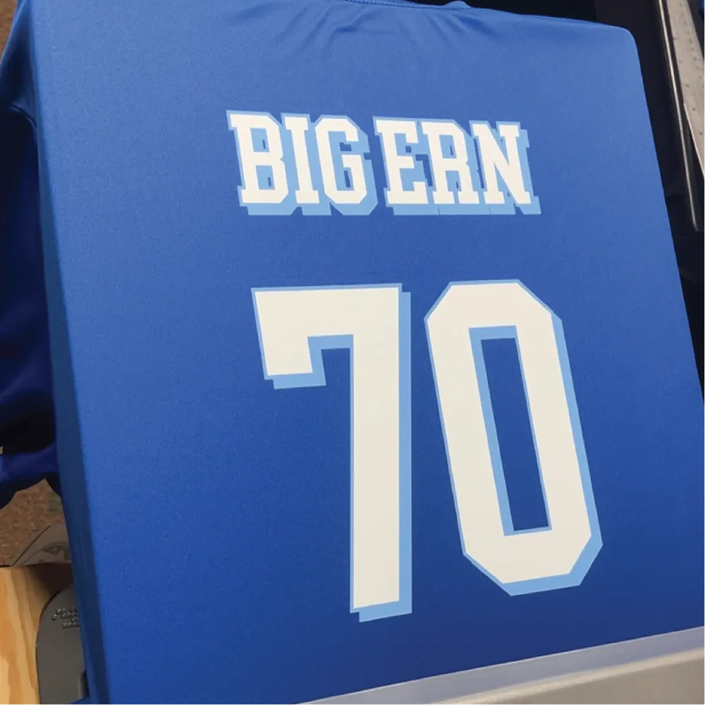 Blue jersey with custom name and number heat-pressed on the back